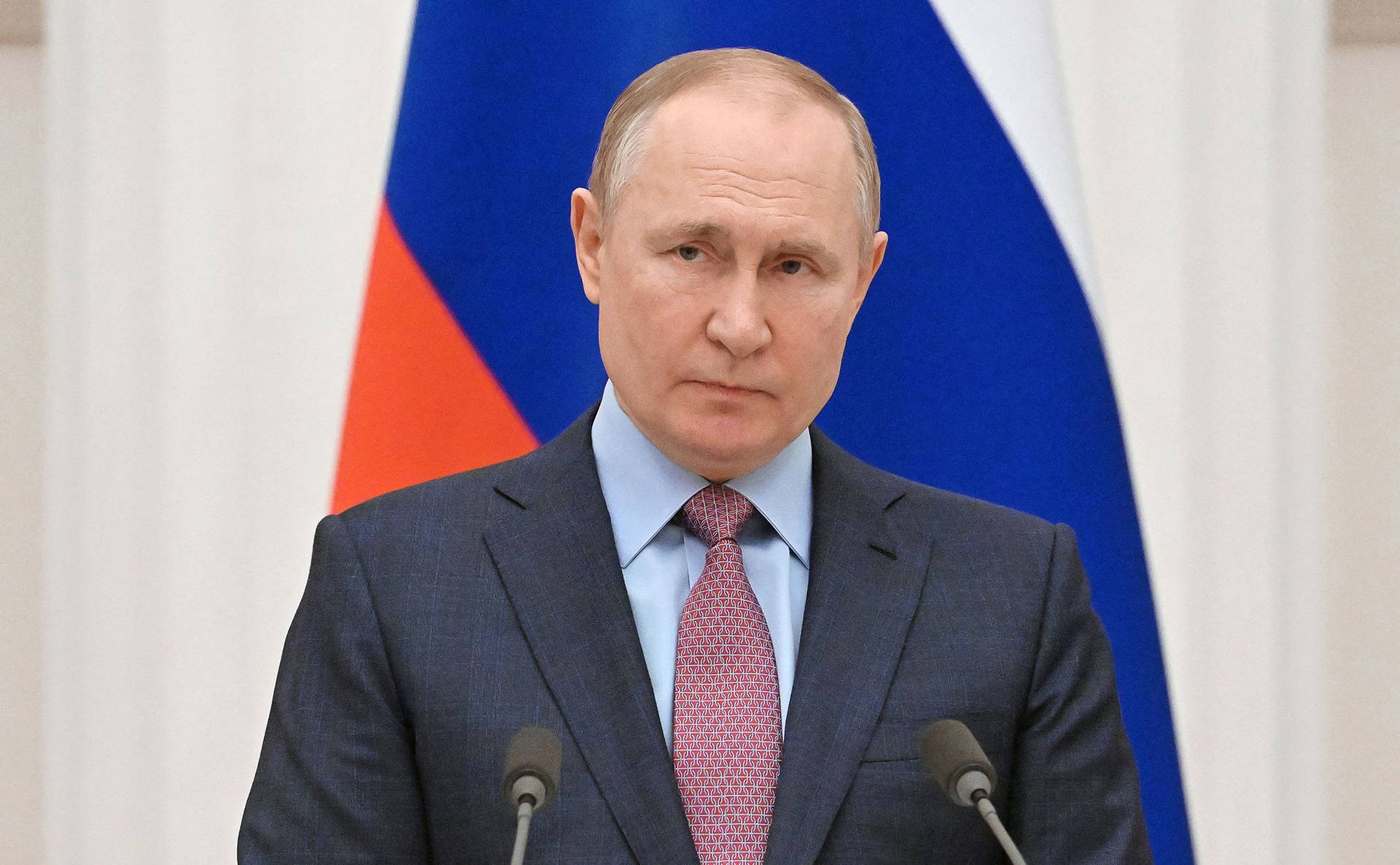 Vladimir Putin With Red And Blue Flag Background