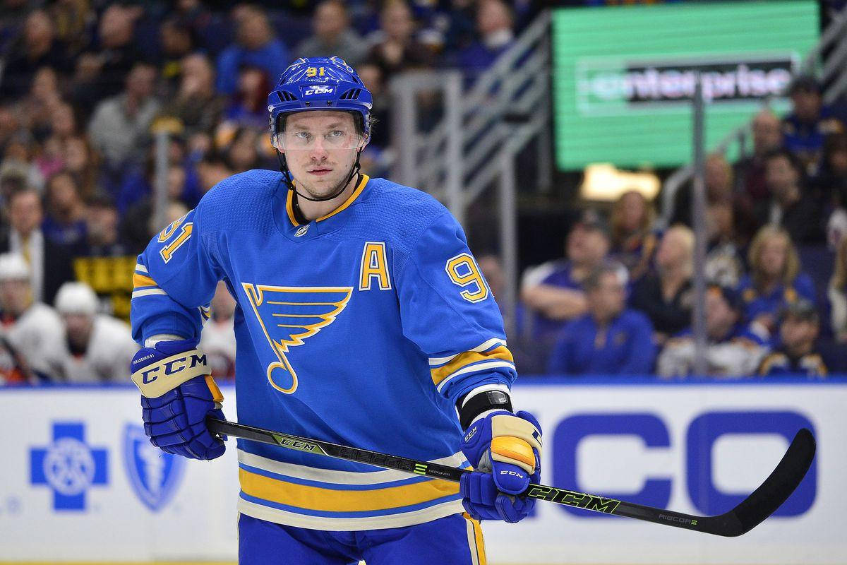 Vladimir Tarasenko Serious Expression While Holding Hockey Stick To The Left Background