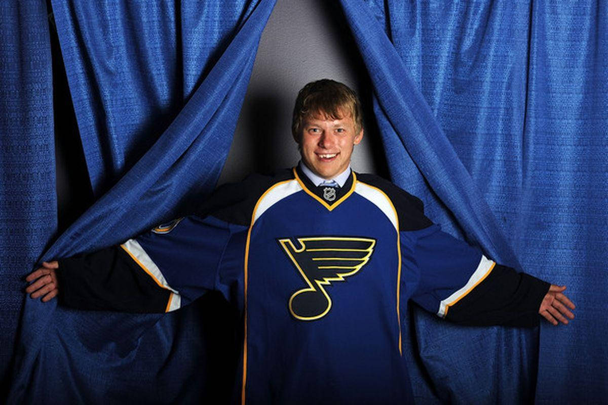 Vladimir Tarasenko Smiling With Arms Open Wearing Oversized Team Jersey