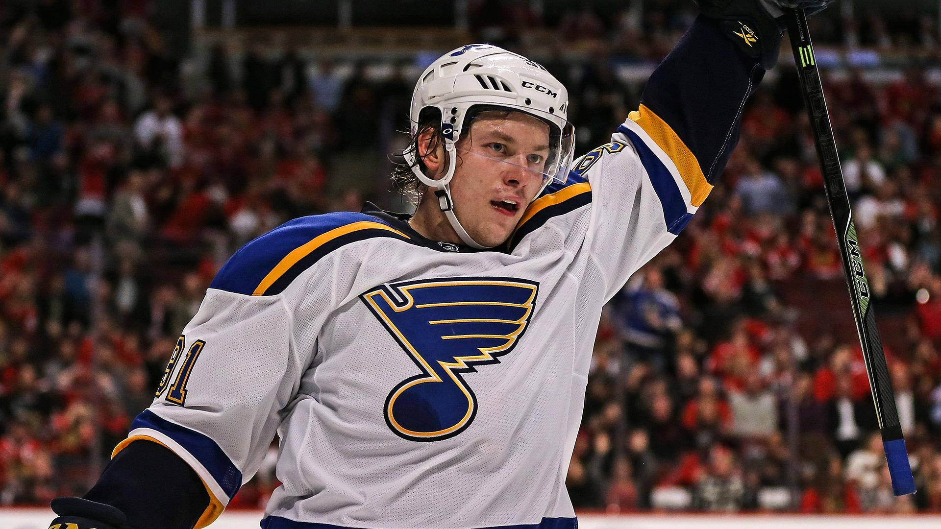 Vladimir Tarasenko Wearing White Team Jersey While Holding Hockey Stick With Left Hand