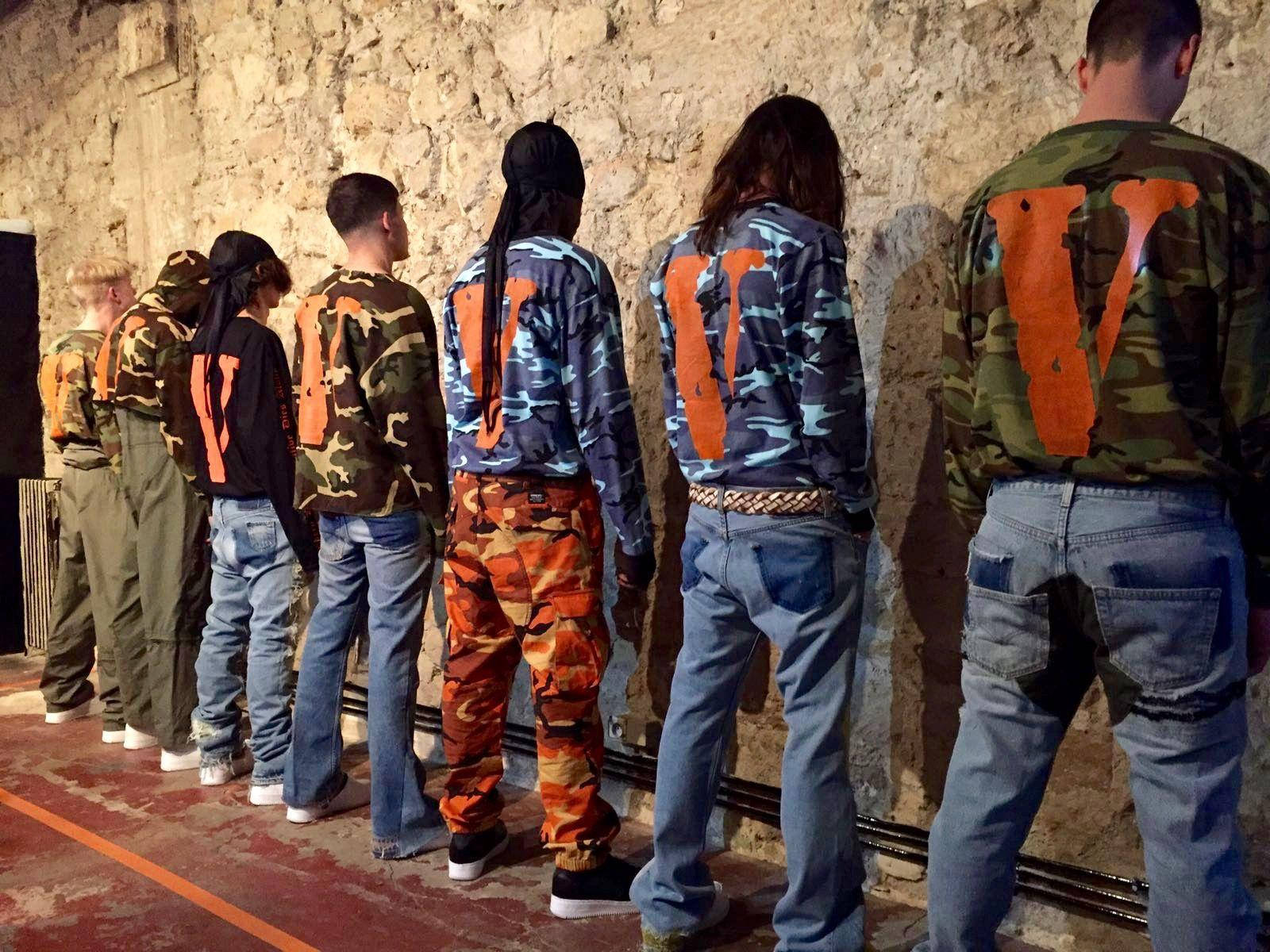 Vlone Models Facing The Wall Background