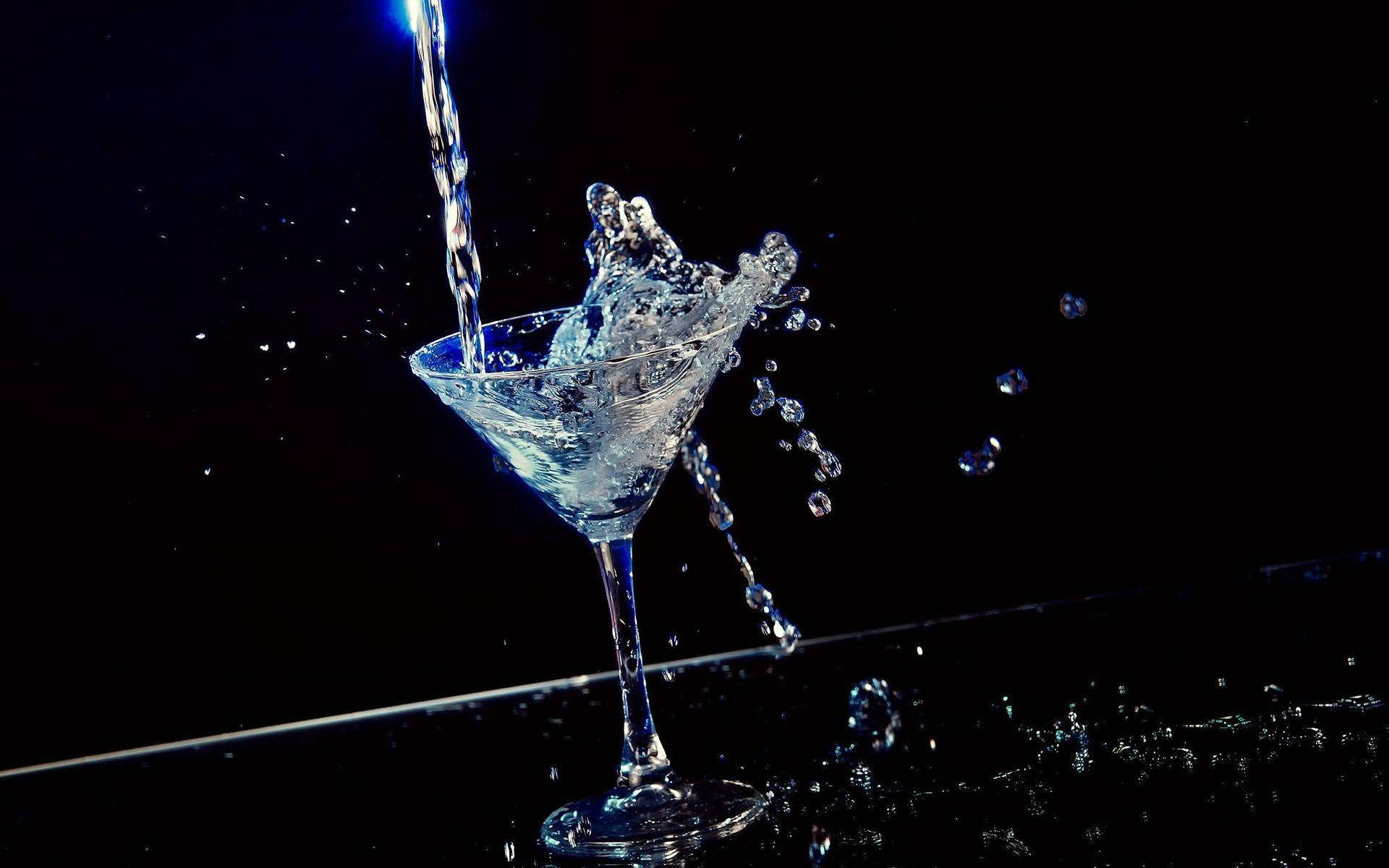 Vodka Splashing On A Cocktail Glass