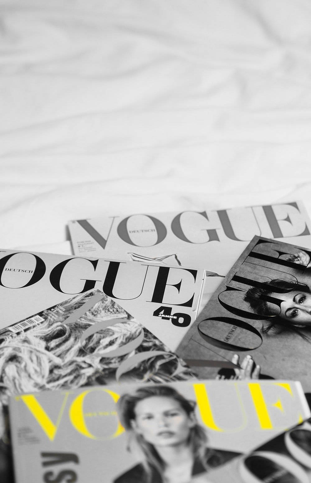 Vogue Magazine Covers In A Bed Background