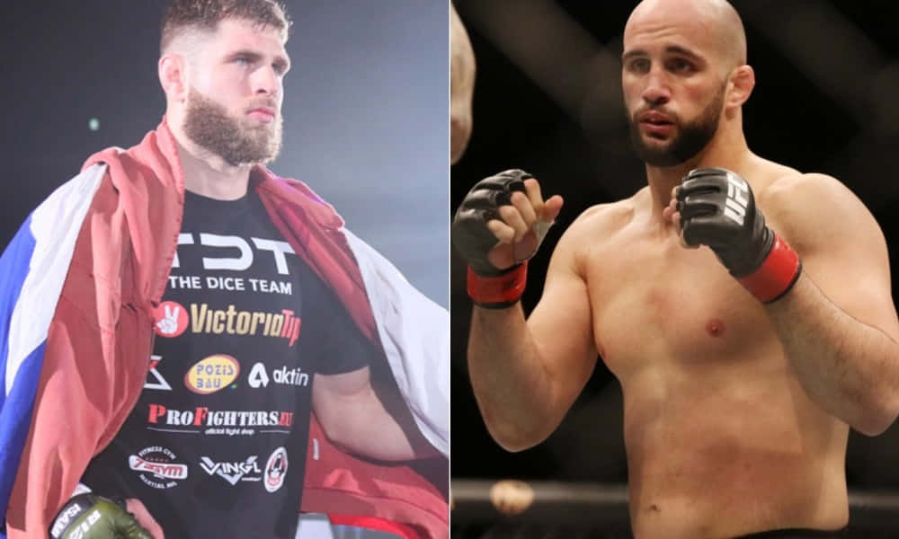 Volkan Oezdemir Delivering A Punch During An Mma Fight Background