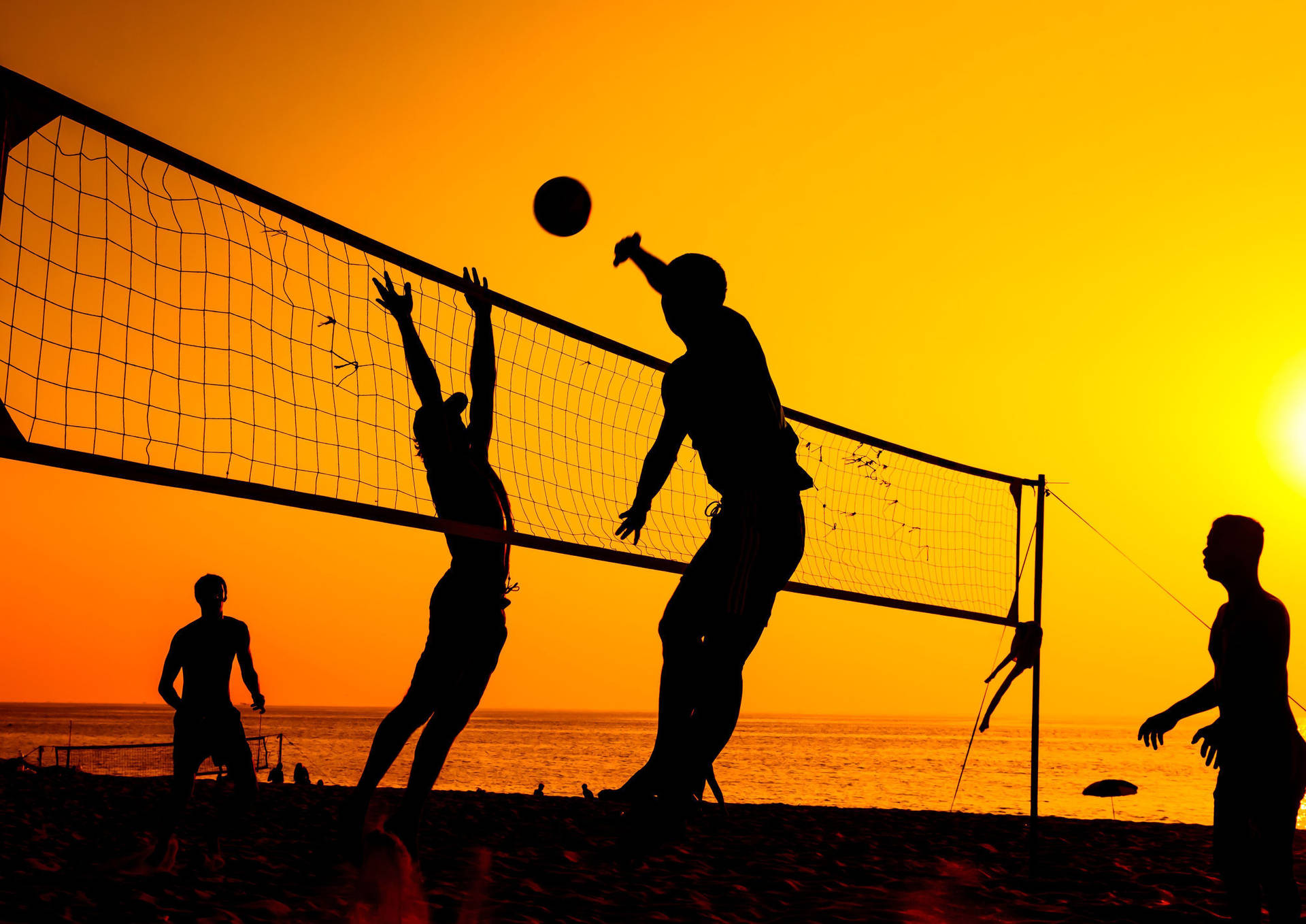 Volleyball Spike At Sunset Background