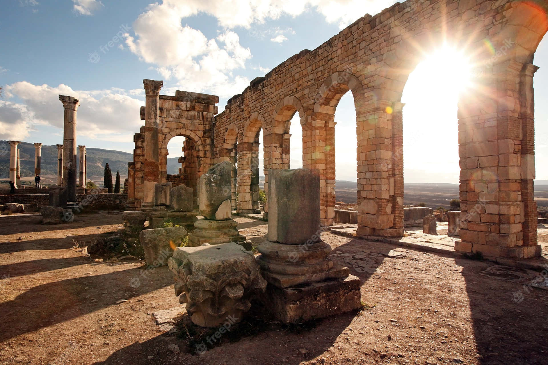 Volubilis Arch Sun Shining Background