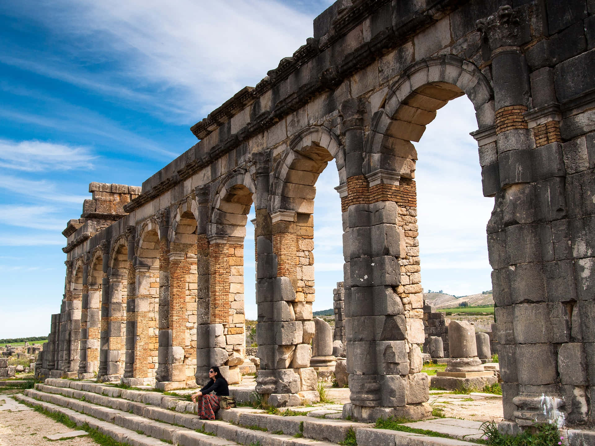 Volubilis Tourist Sitting Background