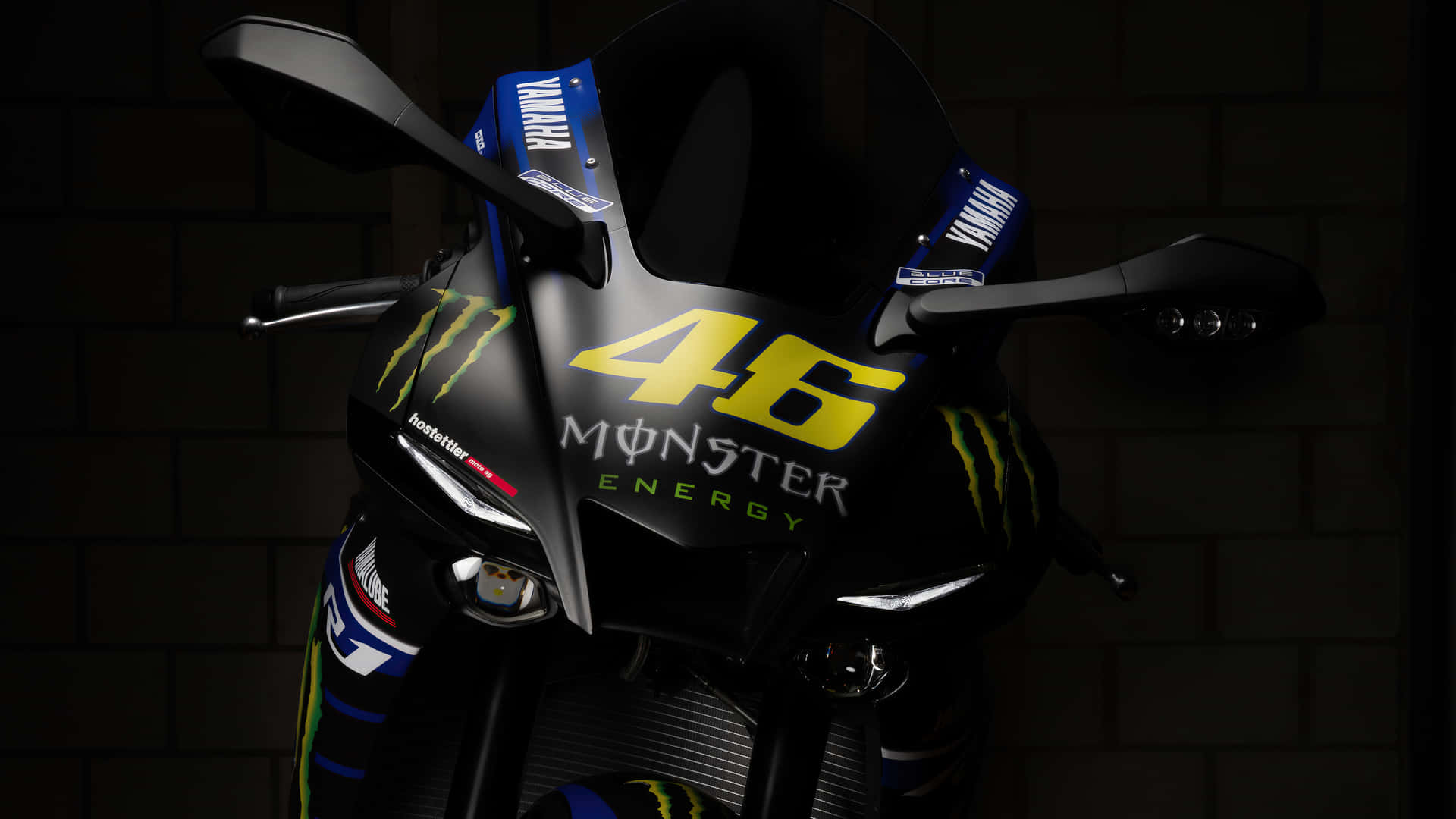 Vr46 Yahama Motorcycle With Monster Energy Logo Background