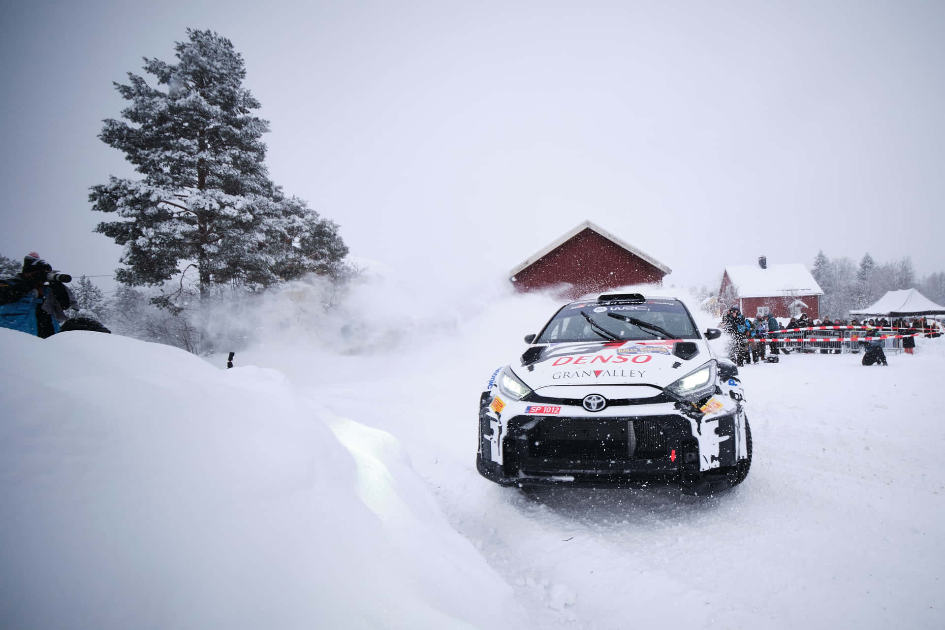 W R C Rally Car Snowy Track Background