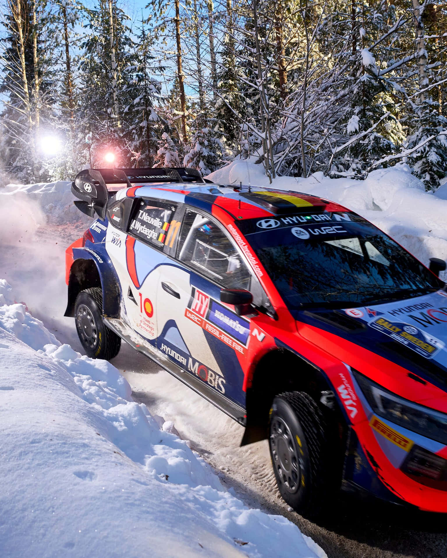 W R C Rally Car Snowy Track Background