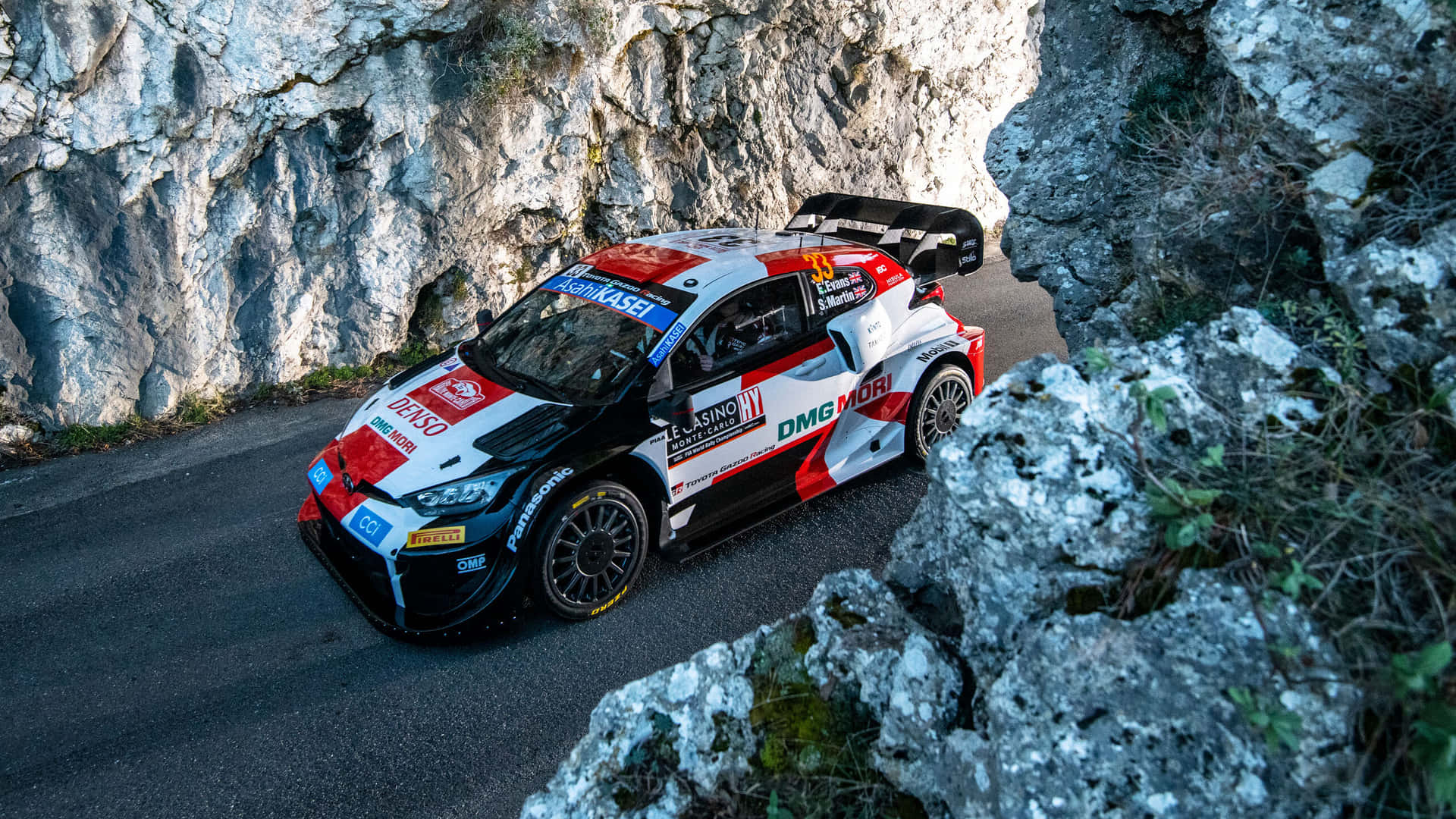 W R C Rally Car Speeding Through Mountain Pass.jpg Background