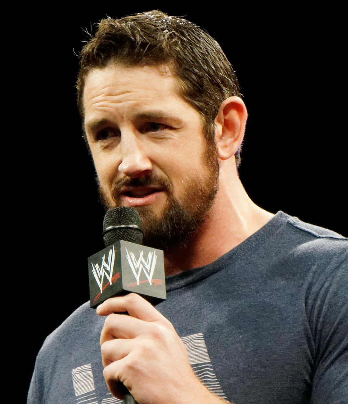 Wade Barrett Holding A Mic Background