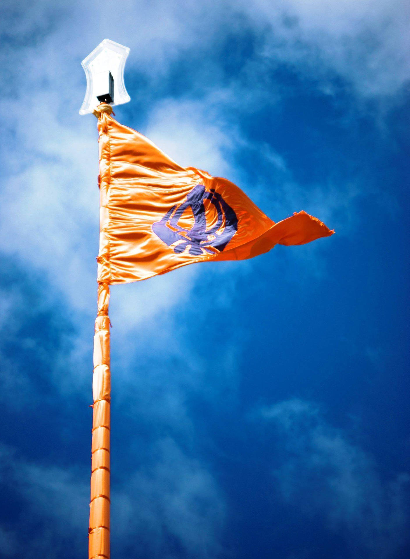 Waheguru Sikhism Symbol On Flag Background