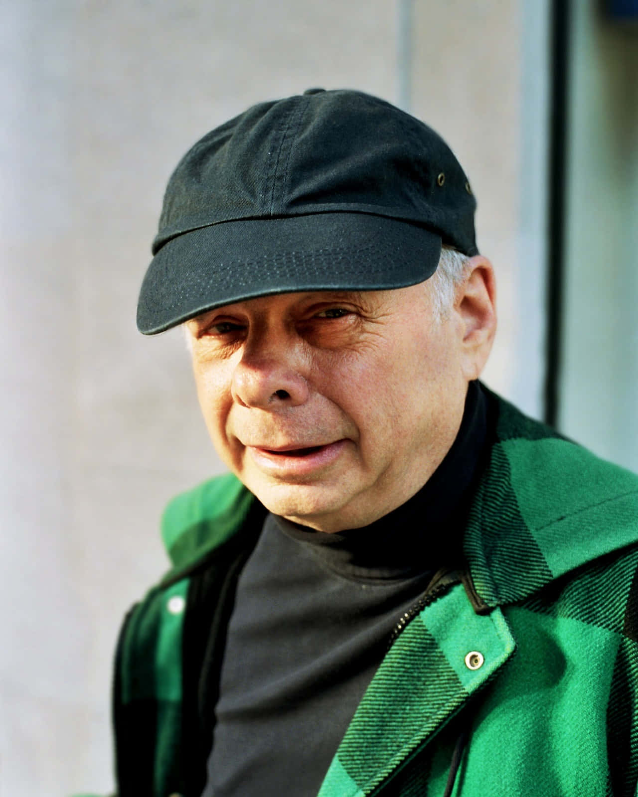 Wallace Shawn Posing For A Portrait Background