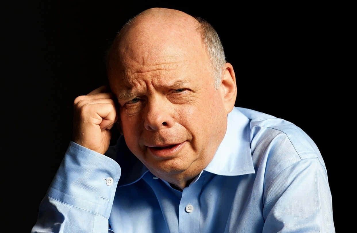 Wallace Shawn Posing In A Studio Background