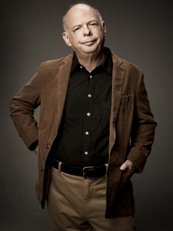 Wallace Shawn Striking A Friendly Pose Background