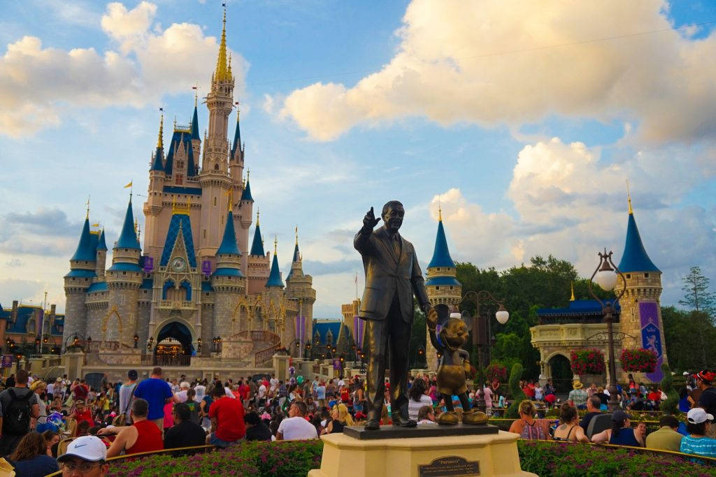 Walt Disneyworld Statue And Castle Background