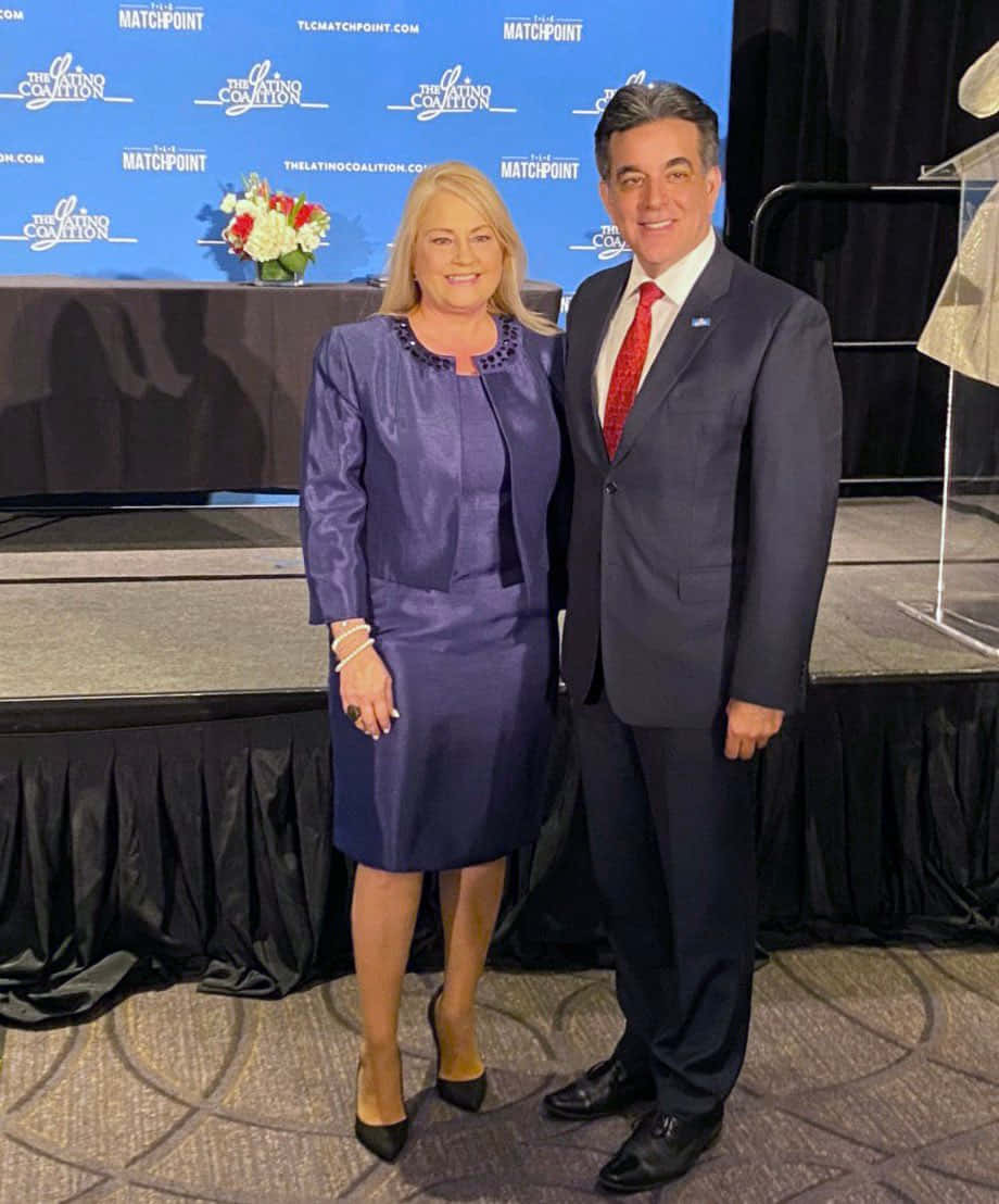 Wanda Vázquez Garced With Hector Baretto Background