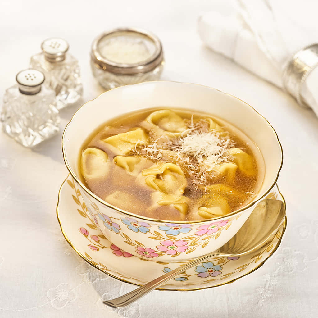 Warm And Hearty Tortellini In Brodo Background