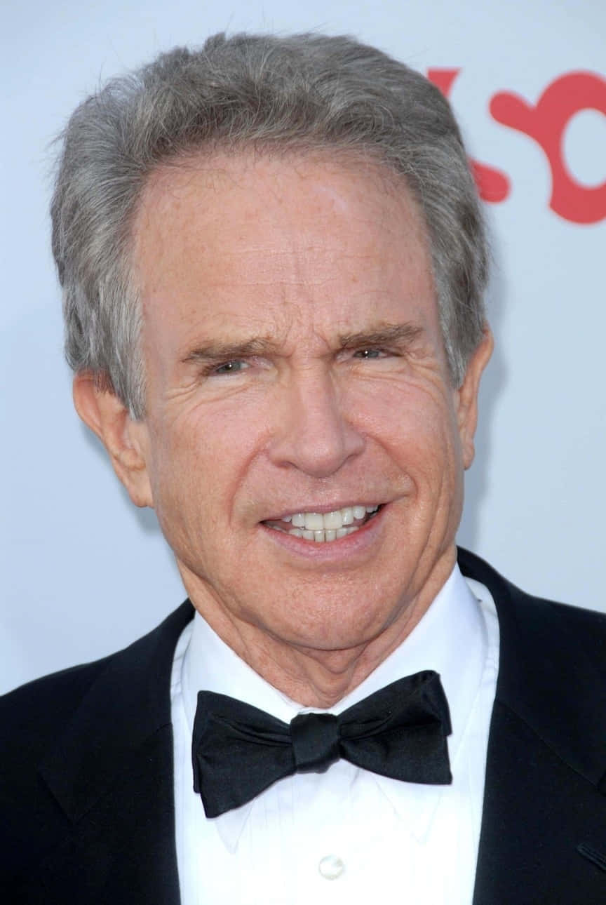 Warren Beatty Posing In A Classic Photo Background
