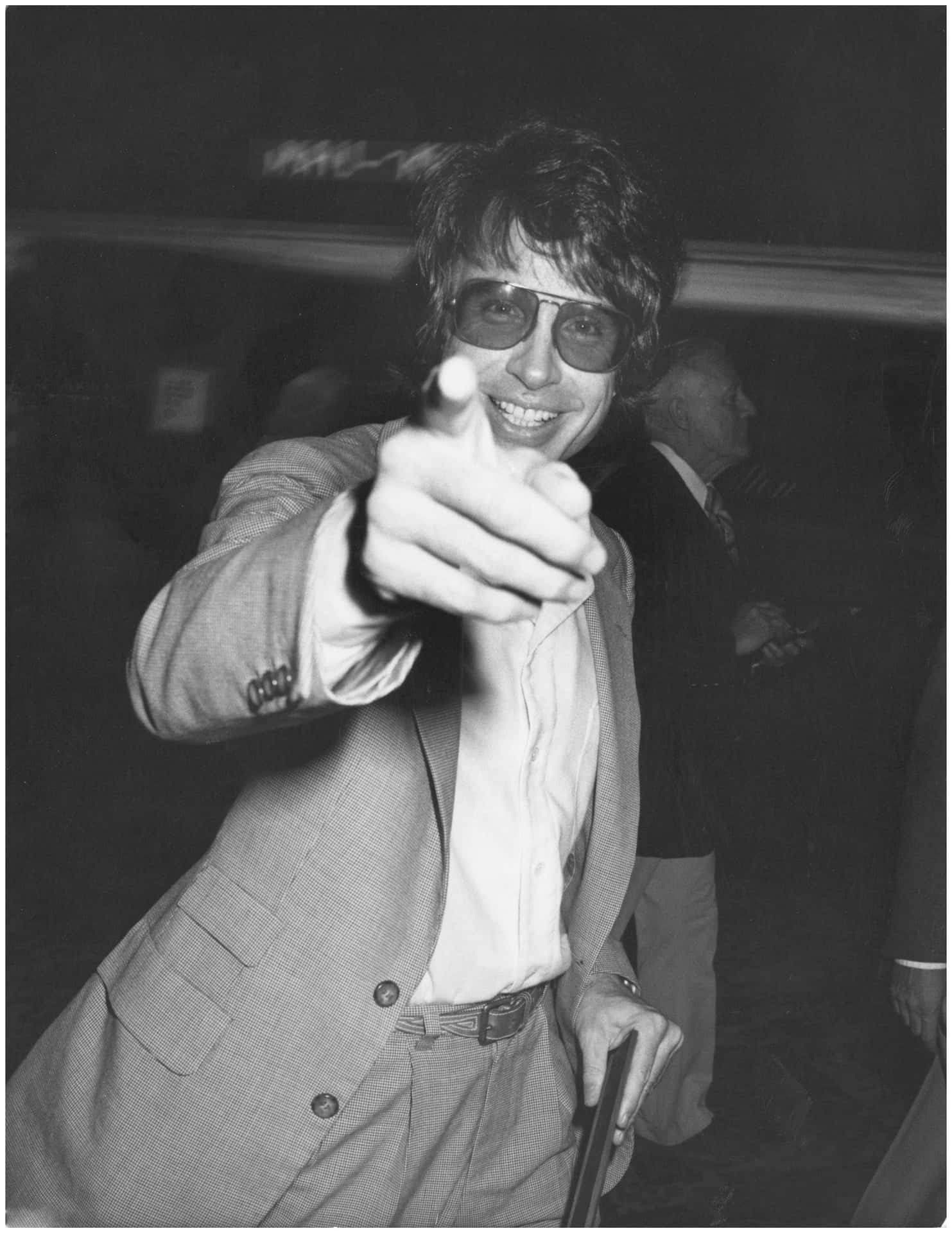 Warren Beatty Smiling In A Classic Pose Background