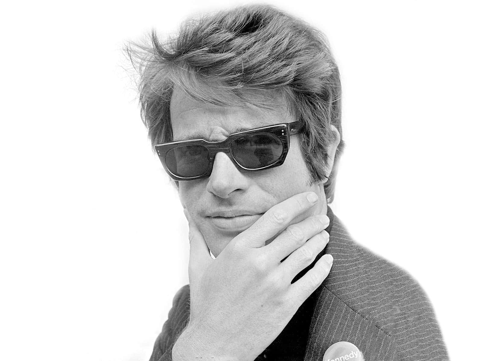 Warren Beatty Smiling In A Suit Background