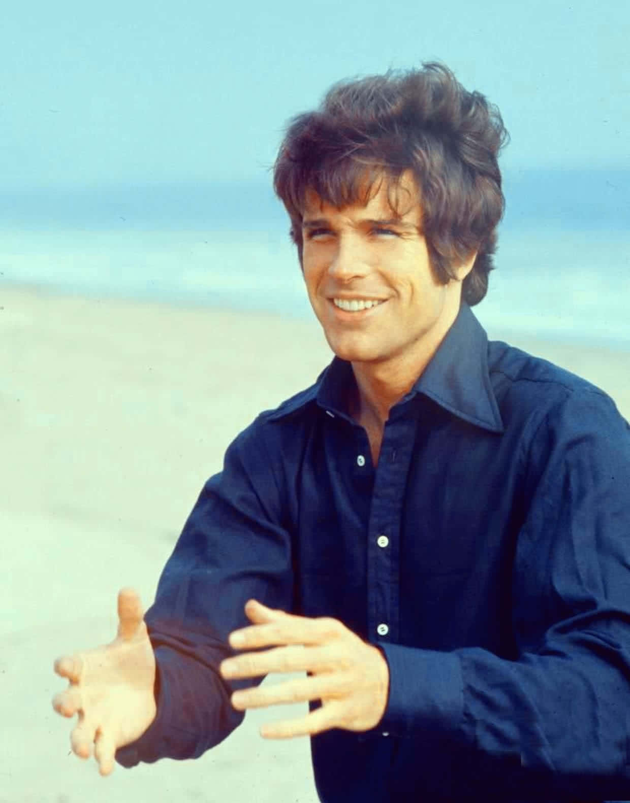 Warren Beatty Smiling In A Suit Background