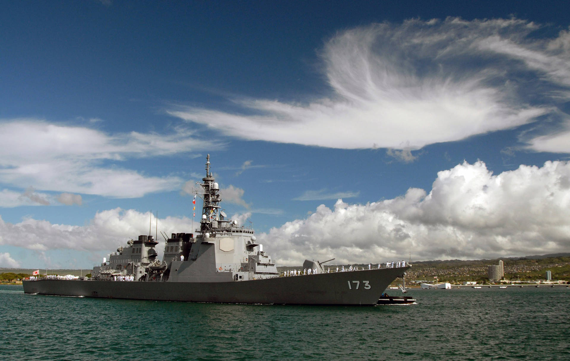 Warship And Cloudy Blue Sky Background