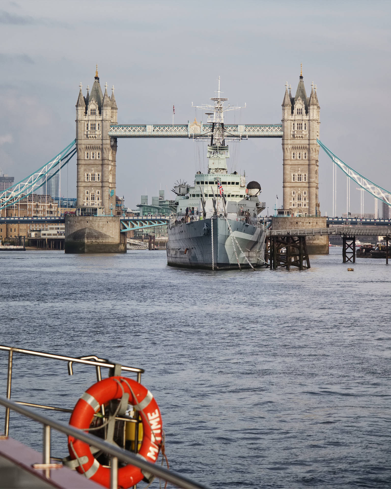 Warship Passing The Tower Bridge Background