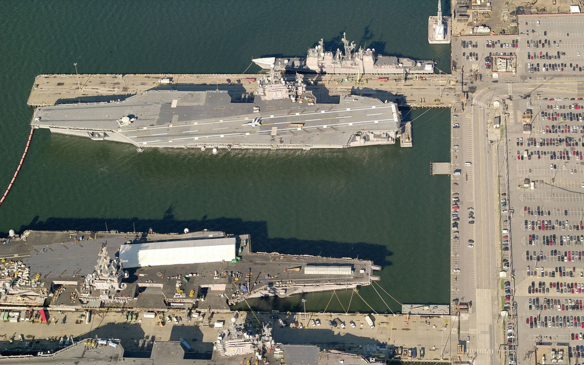 Warships Docked In Port Background