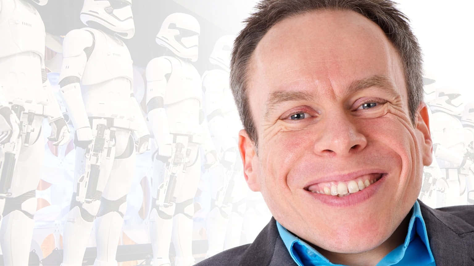 Warwick Davis Posing With Confidence At A Public Event Background
