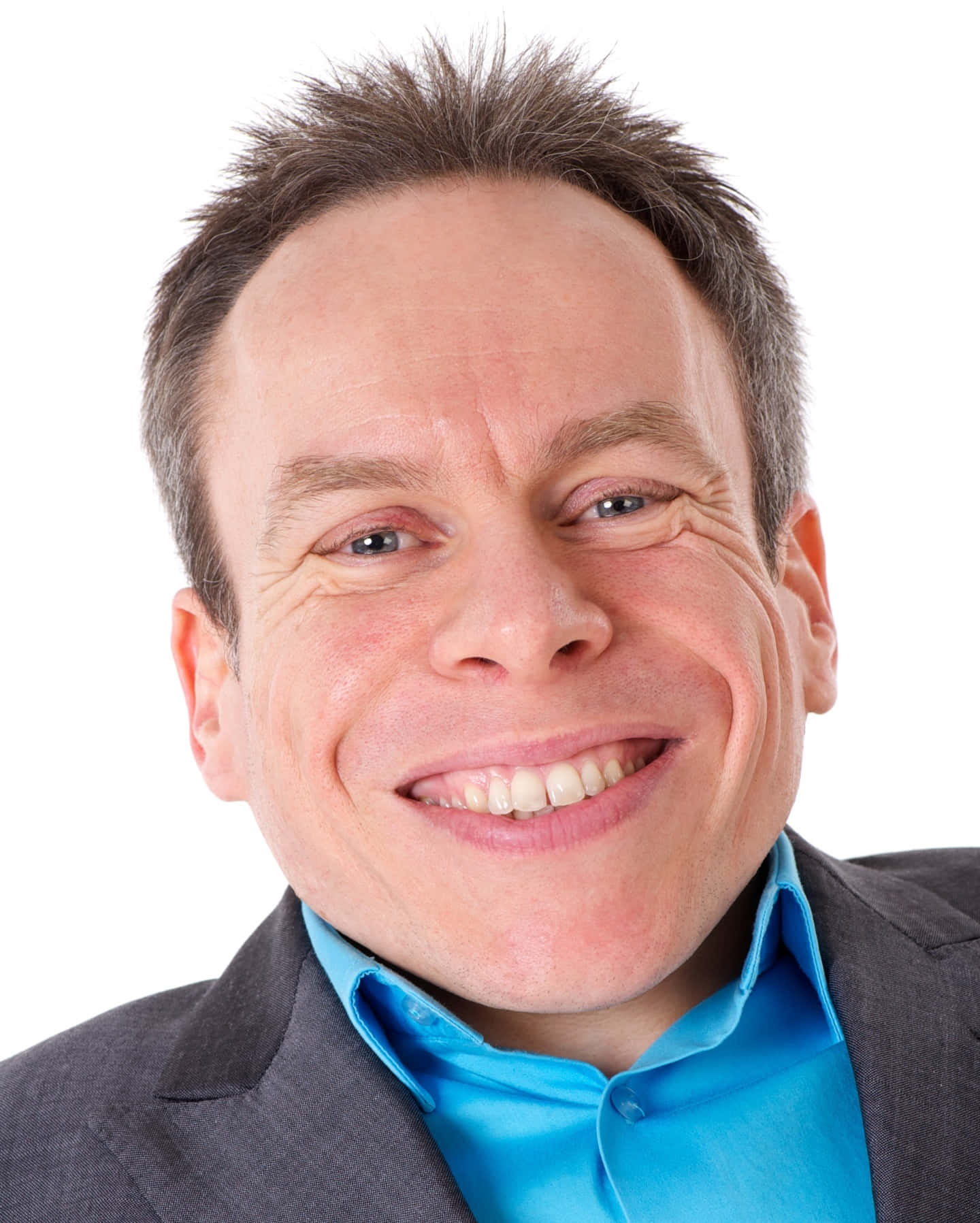 Warwick Davis Smiling At An Event Background