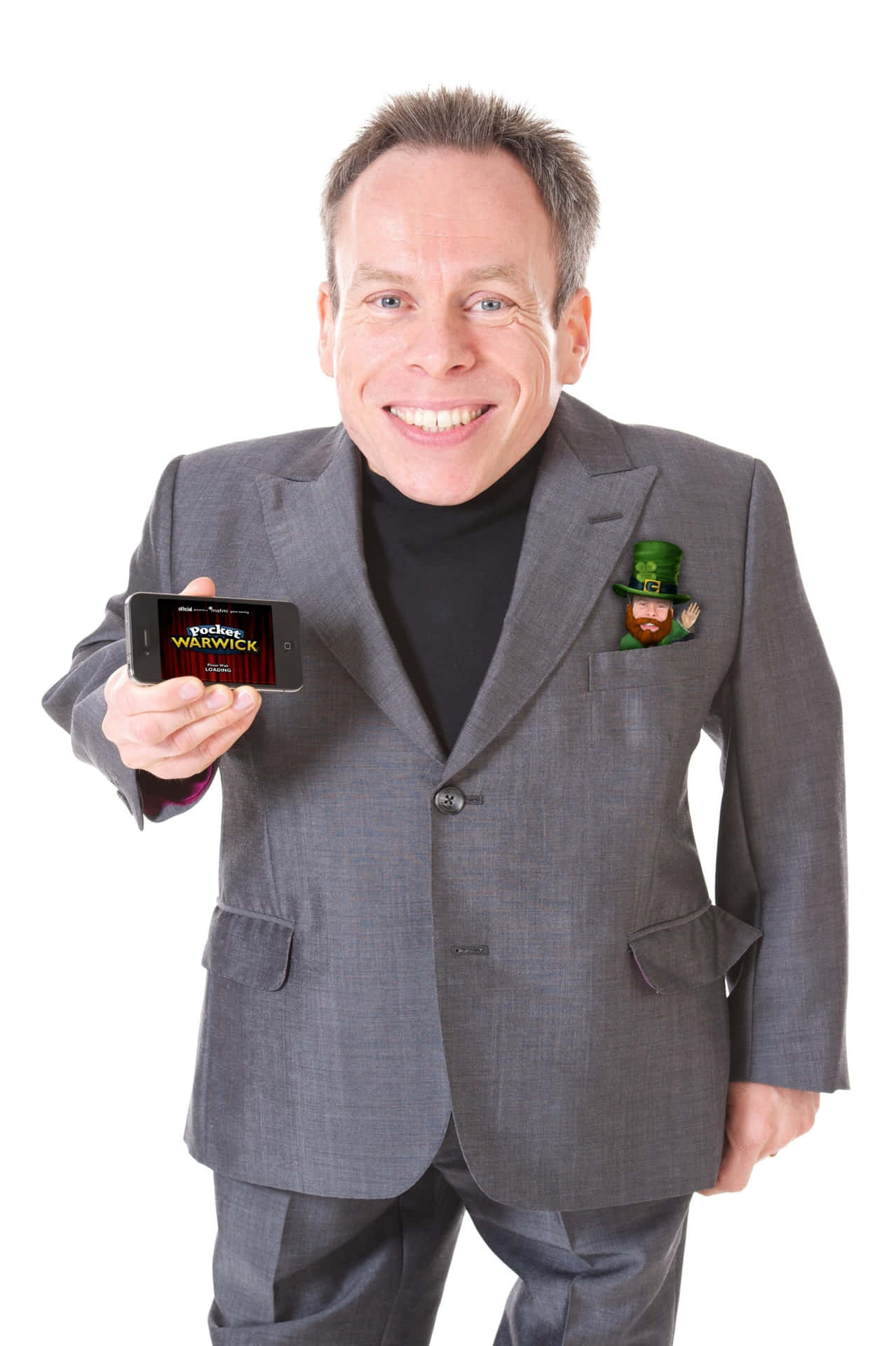Warwick Davis Smiling In A Portrait Background