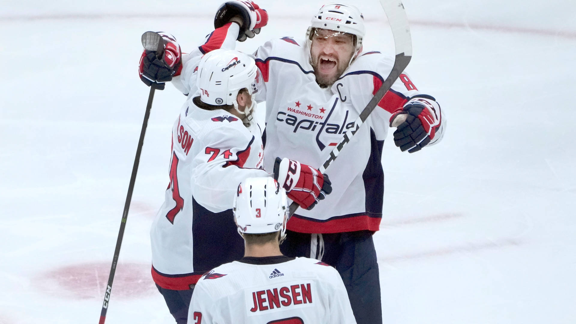 Washington Capitals Celebrating John Carlson And Alexander Ovechkin Background