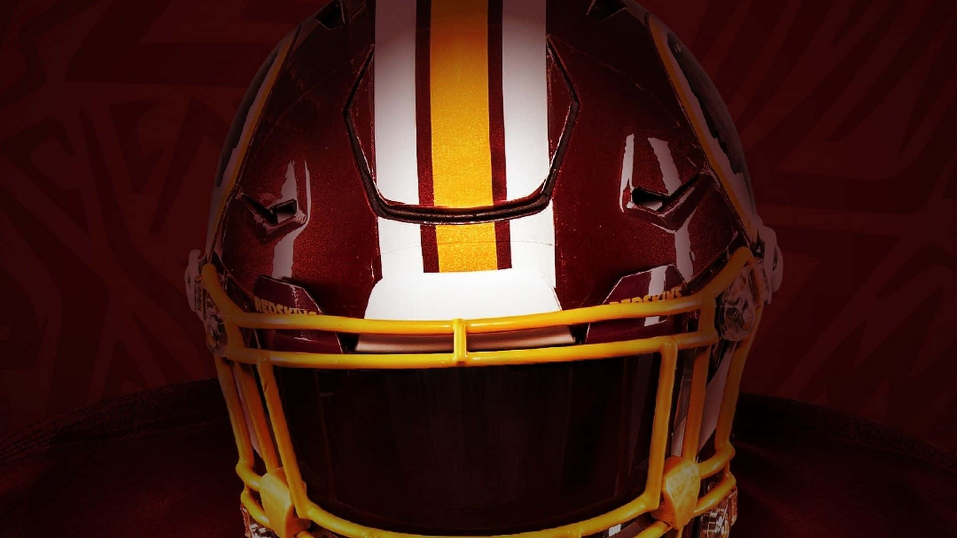 Washington Football Team In Action On The Field Background