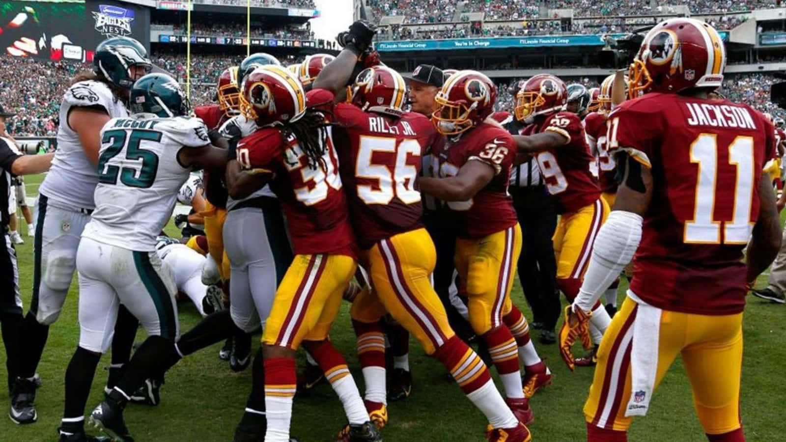 Washington Football Team Players Celebrating Victory On The Field Background