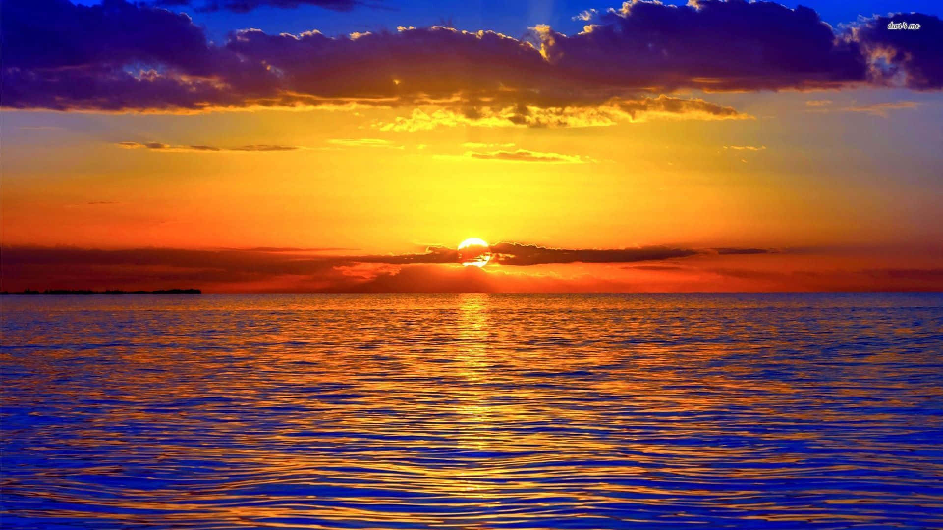 Watch The Colors Of A Beautiful Sunrise From Your Desktop Background