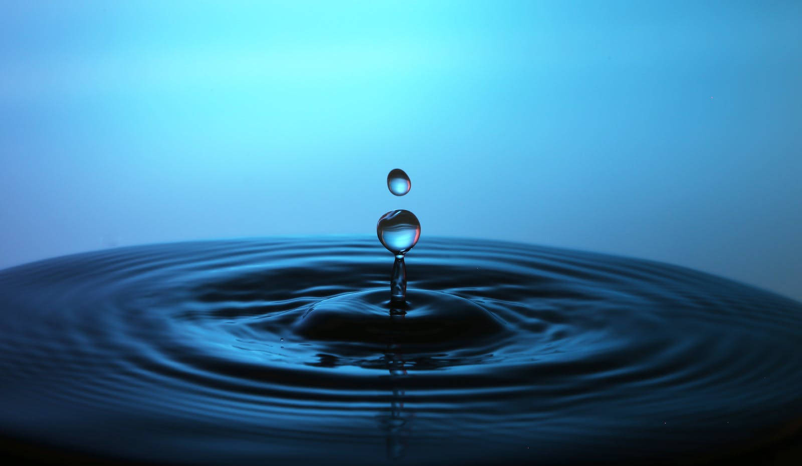 Water Droplets On Water Background