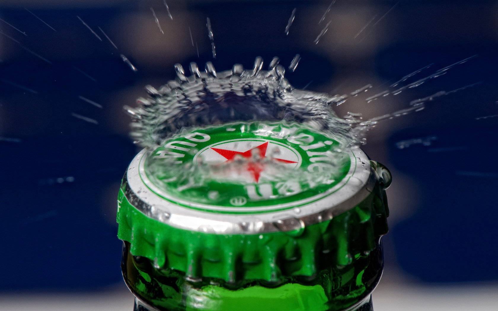 Water Splash On Heineken Lager Beer Bottle Cap Background