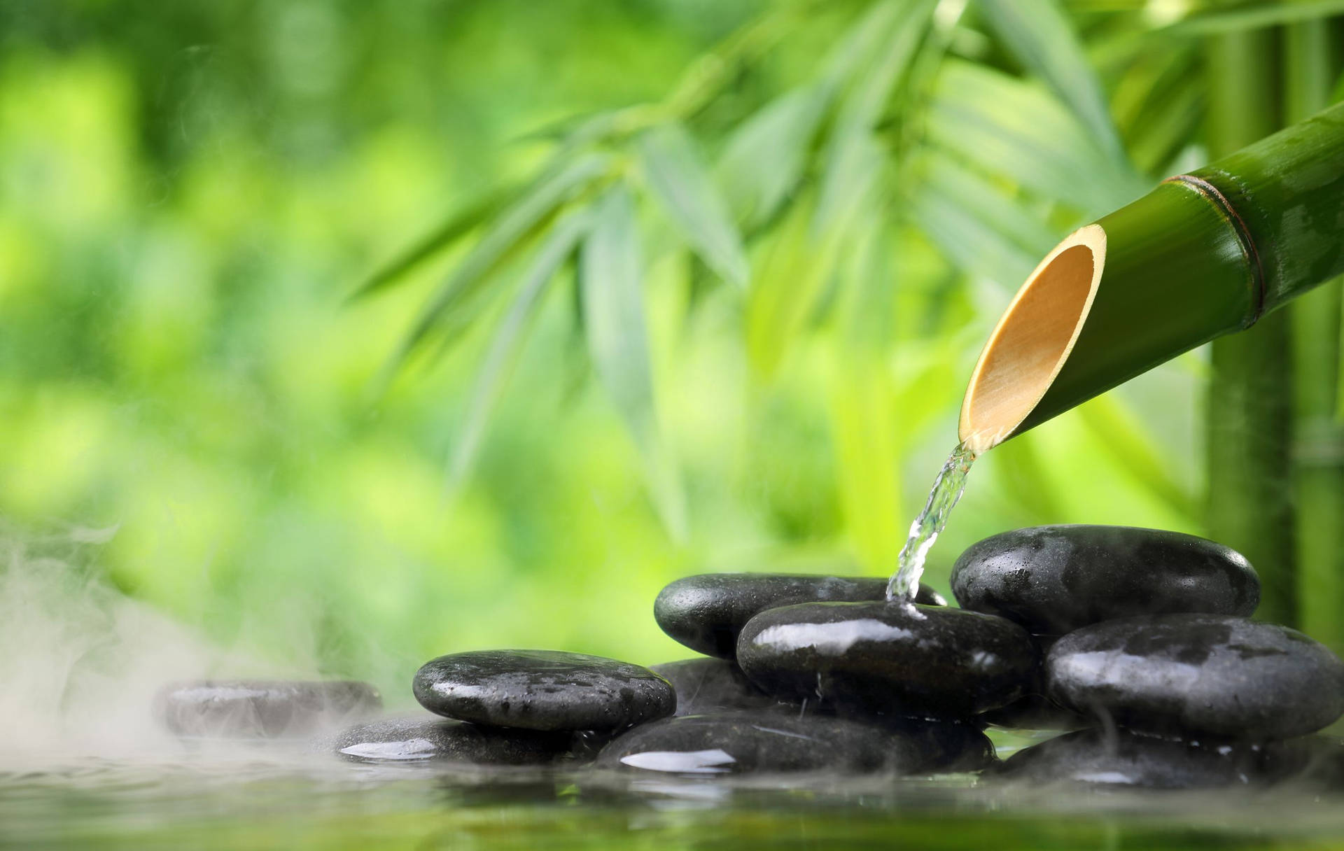 Water Streaming From Bamboo To Zen Stones Therapy Background