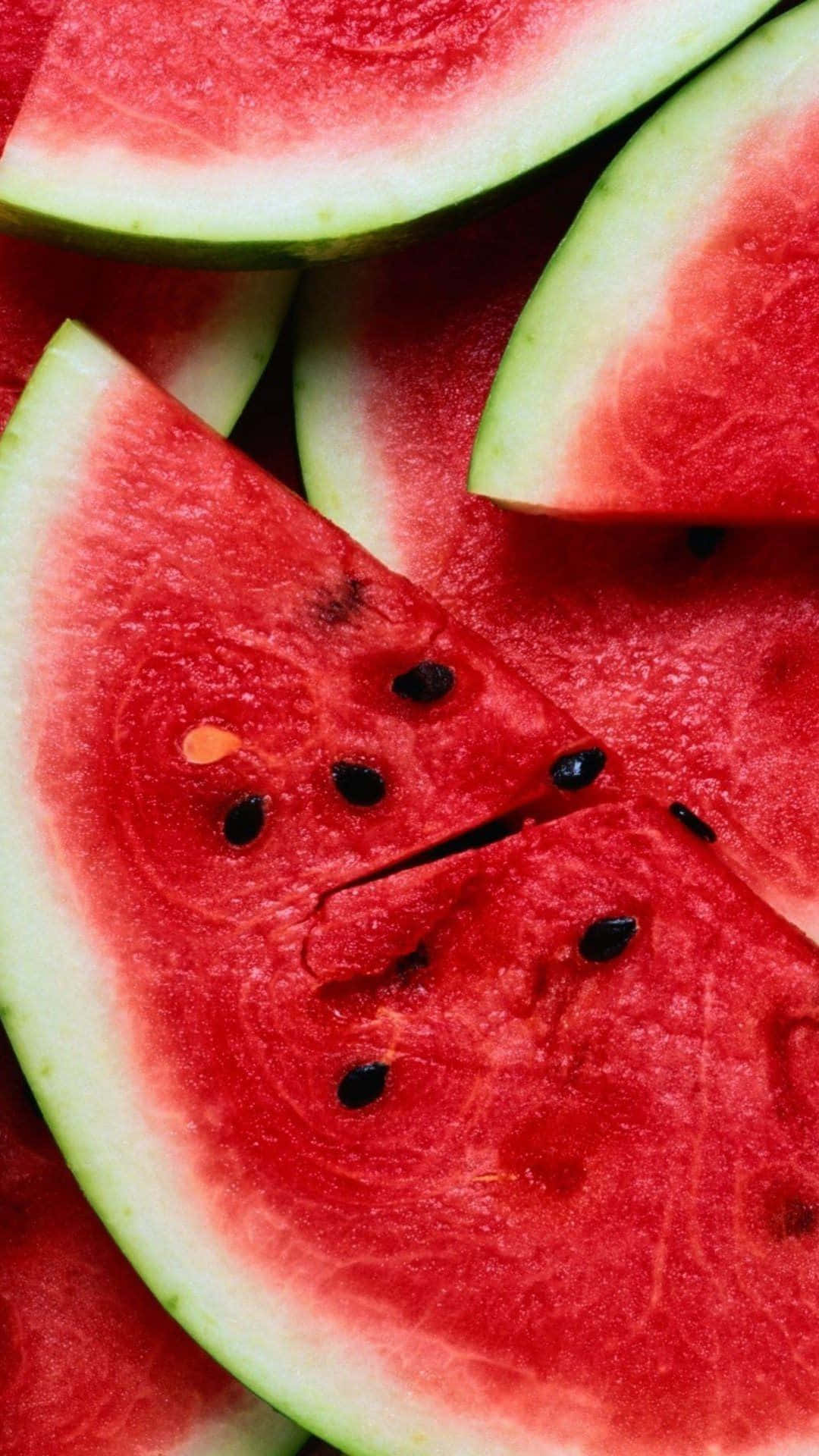 Watermelon Slices Are Arranged In A Close Up Background