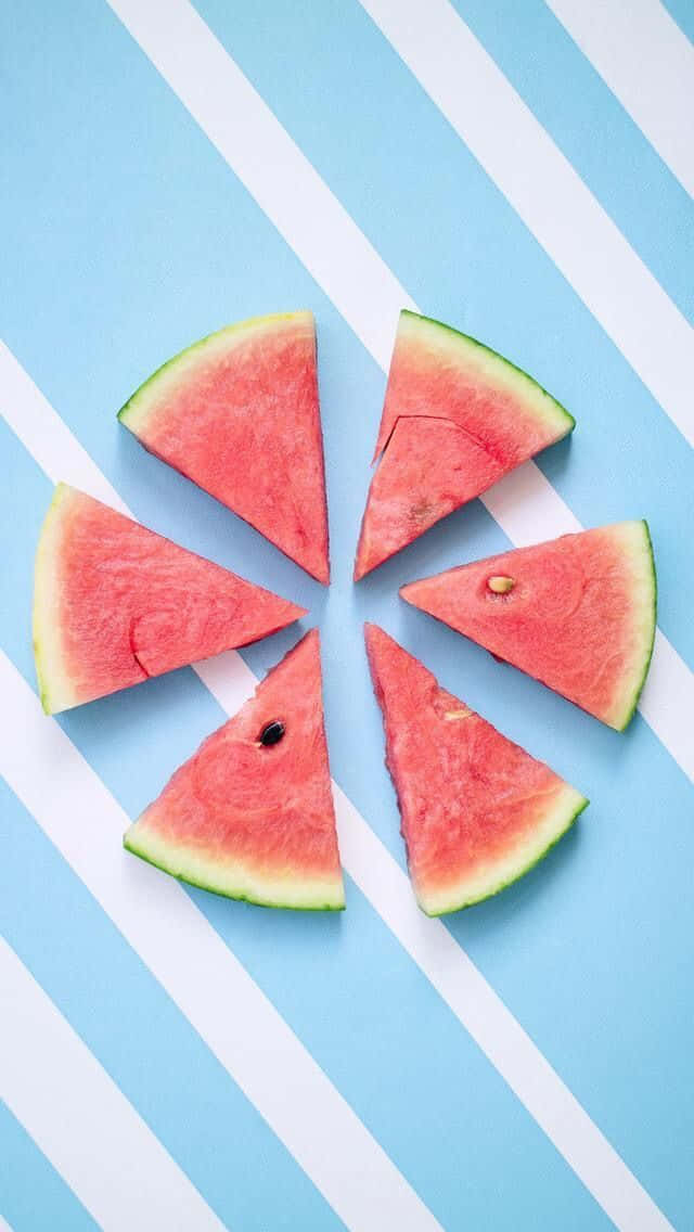 Watermelon Slices On A Blue And White Background Background