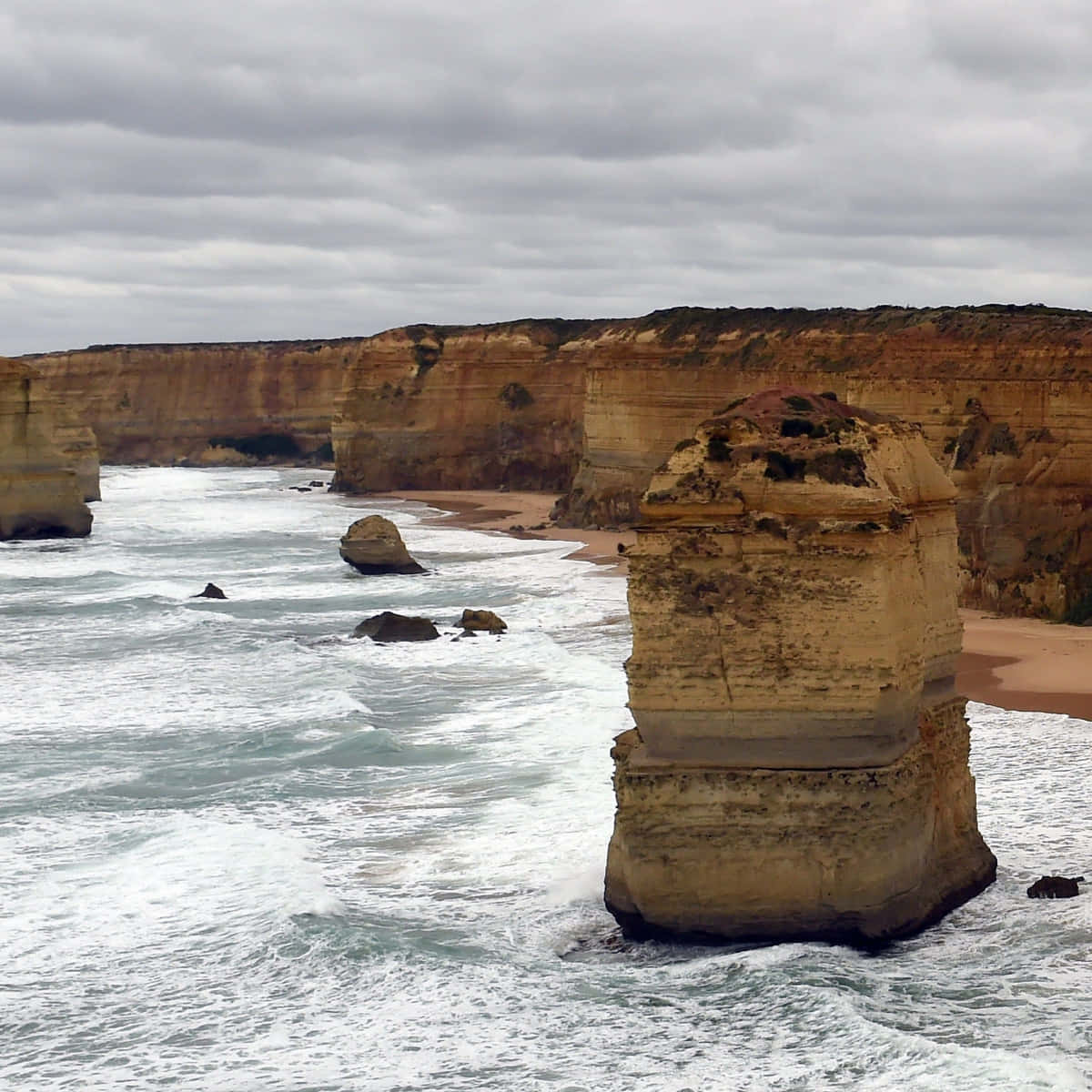Waves Crashing In Twelve Apostles In Victoria Australia Background