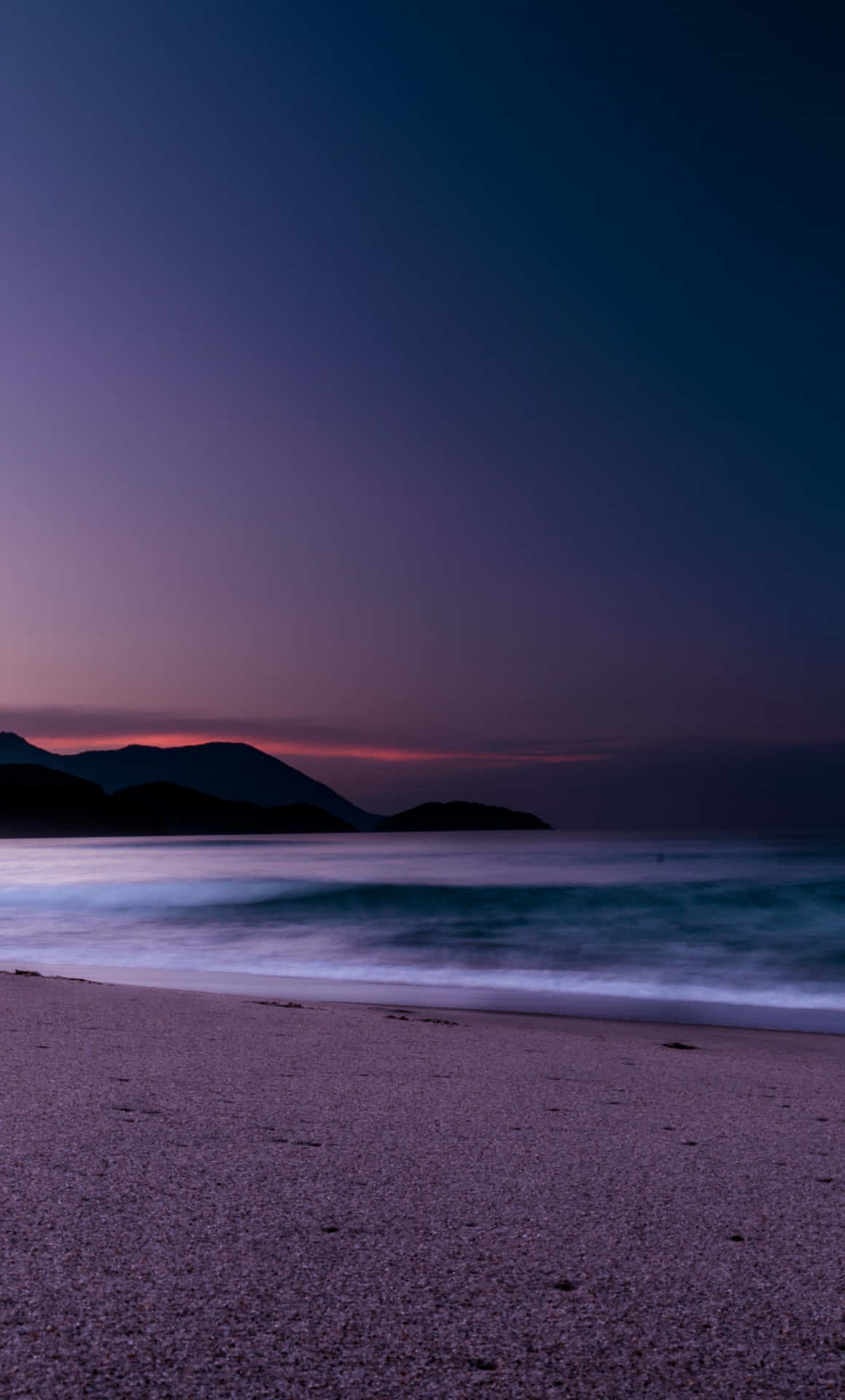 Waves On The Shore On Blue And Purple Sunset Background