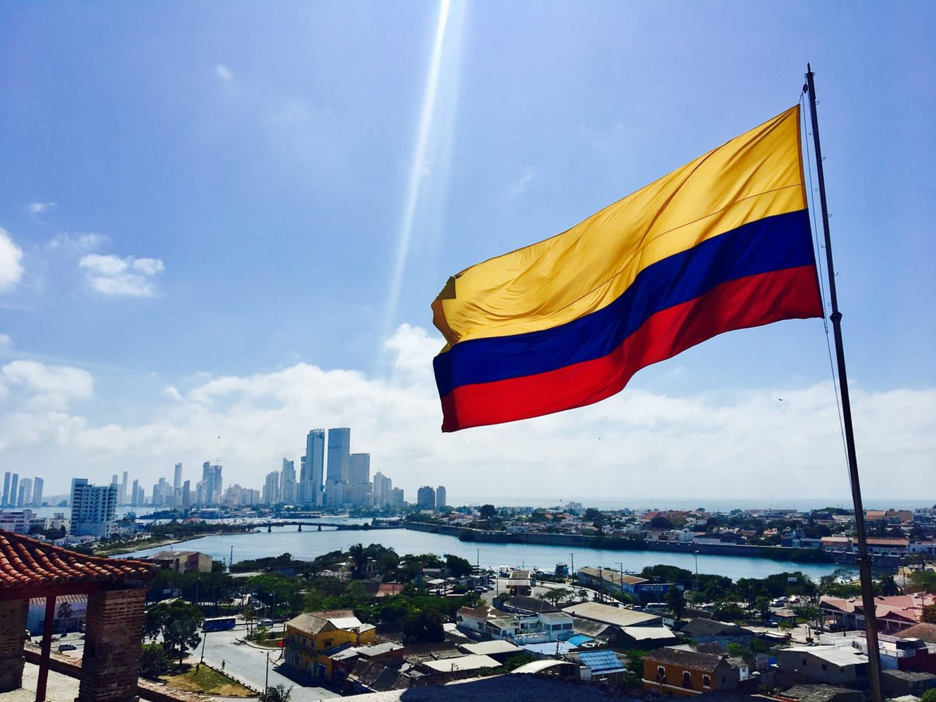 Waving Flag Of Colombia Background
