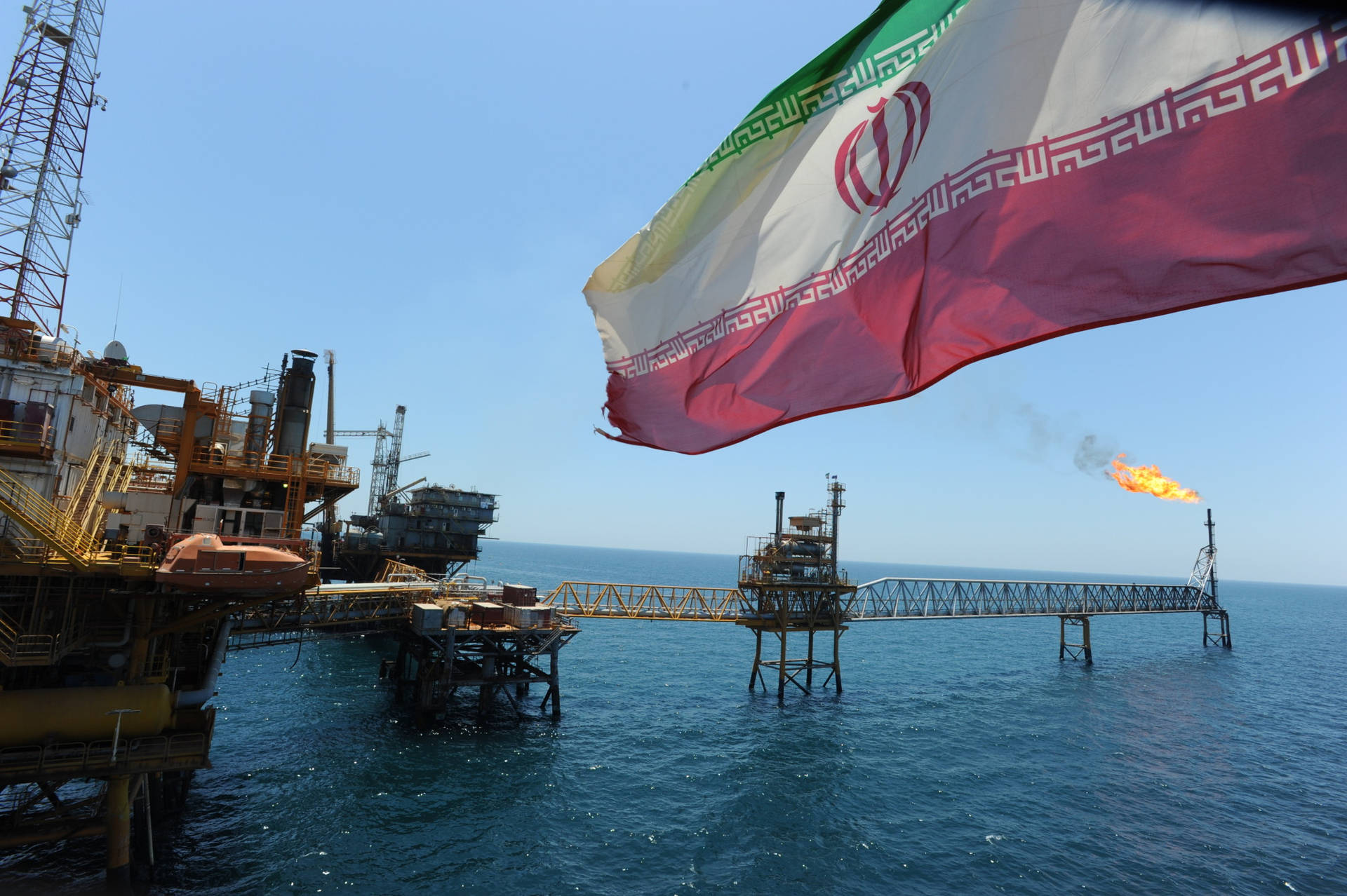 Waving Iran Flag By Sea Background