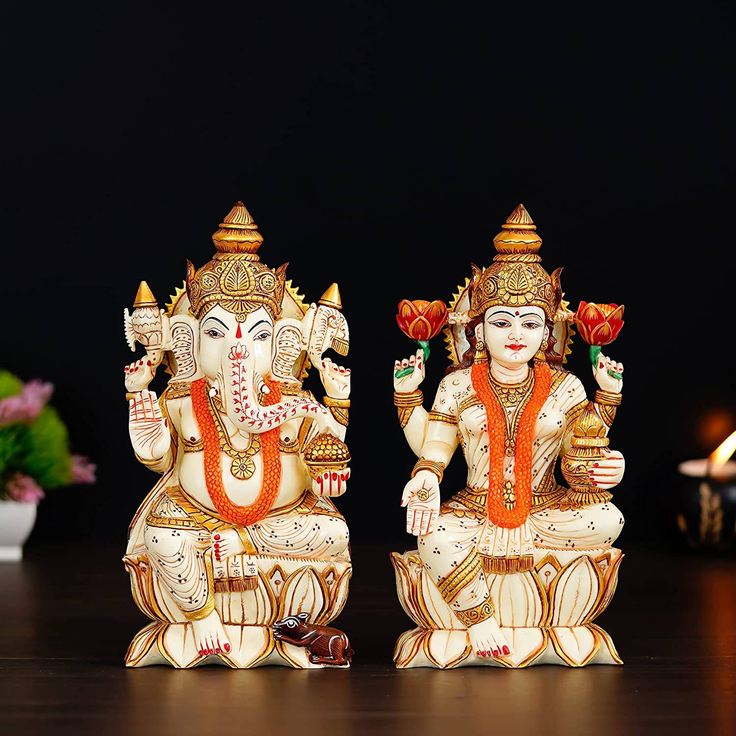 Wax Figurines Of Ganesh Lakshmi Background
