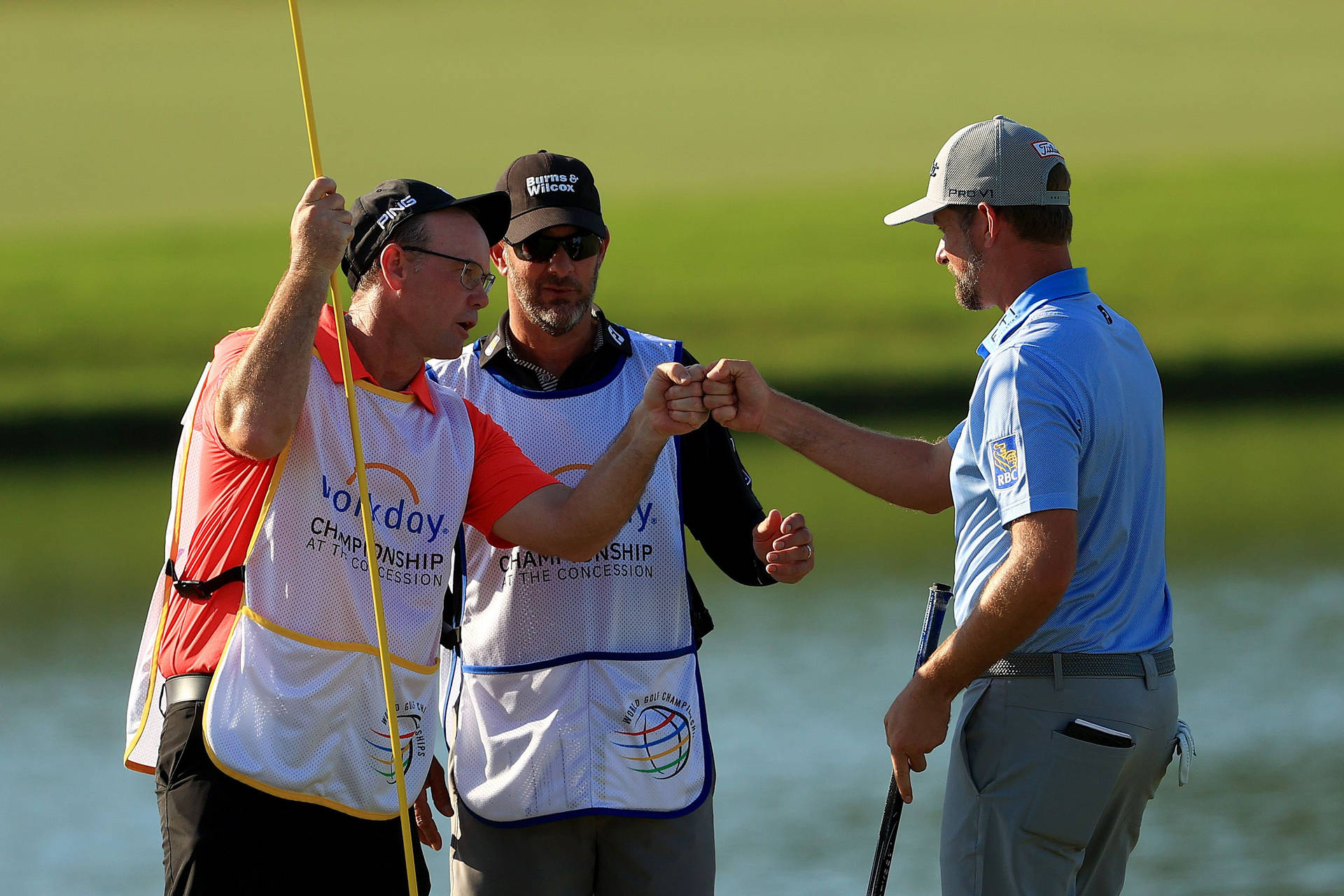 Webb Simpson Fist Bumping Fellow Players