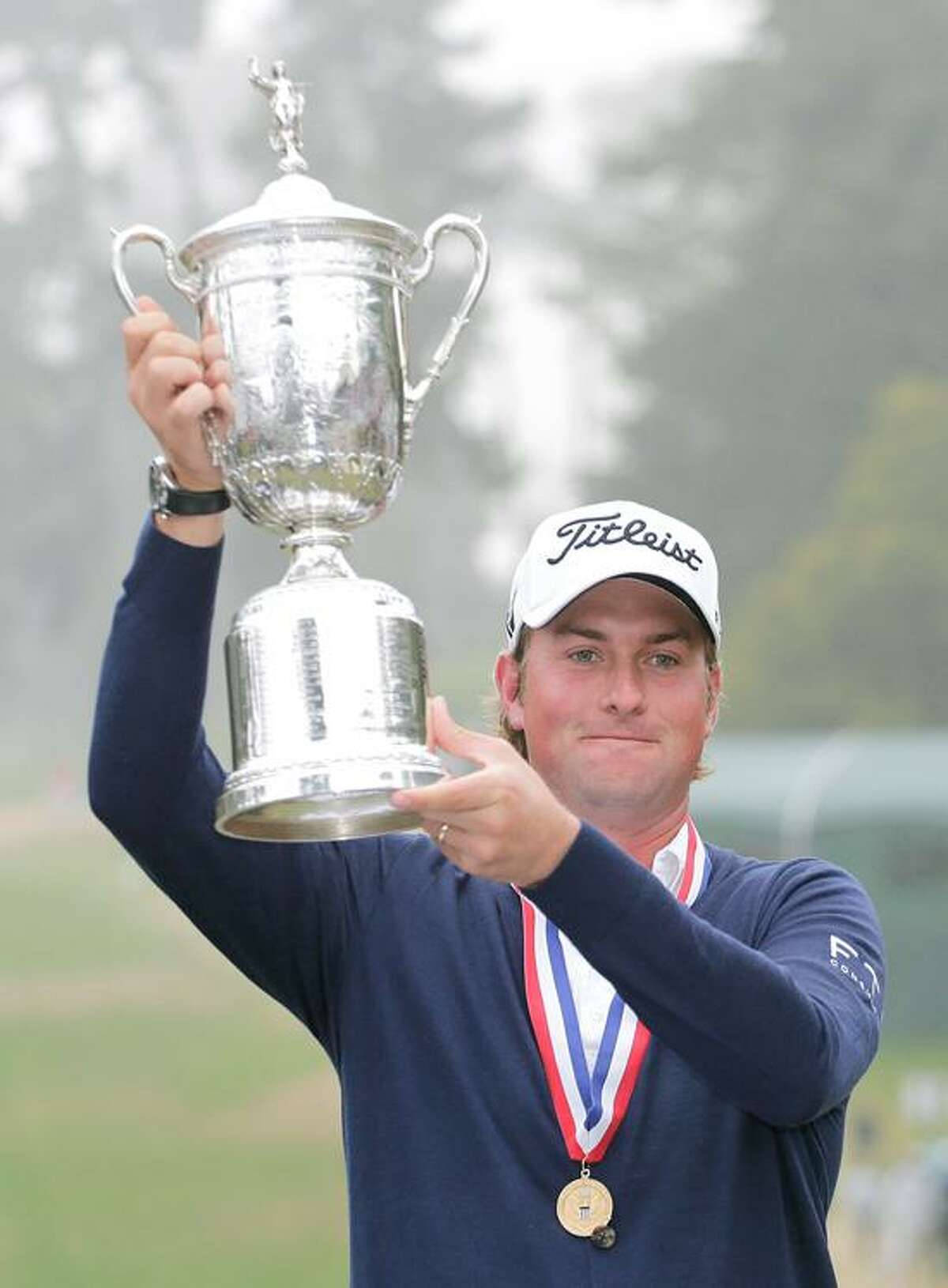 Webb Simpson Proudly Holding A Silver Trophy