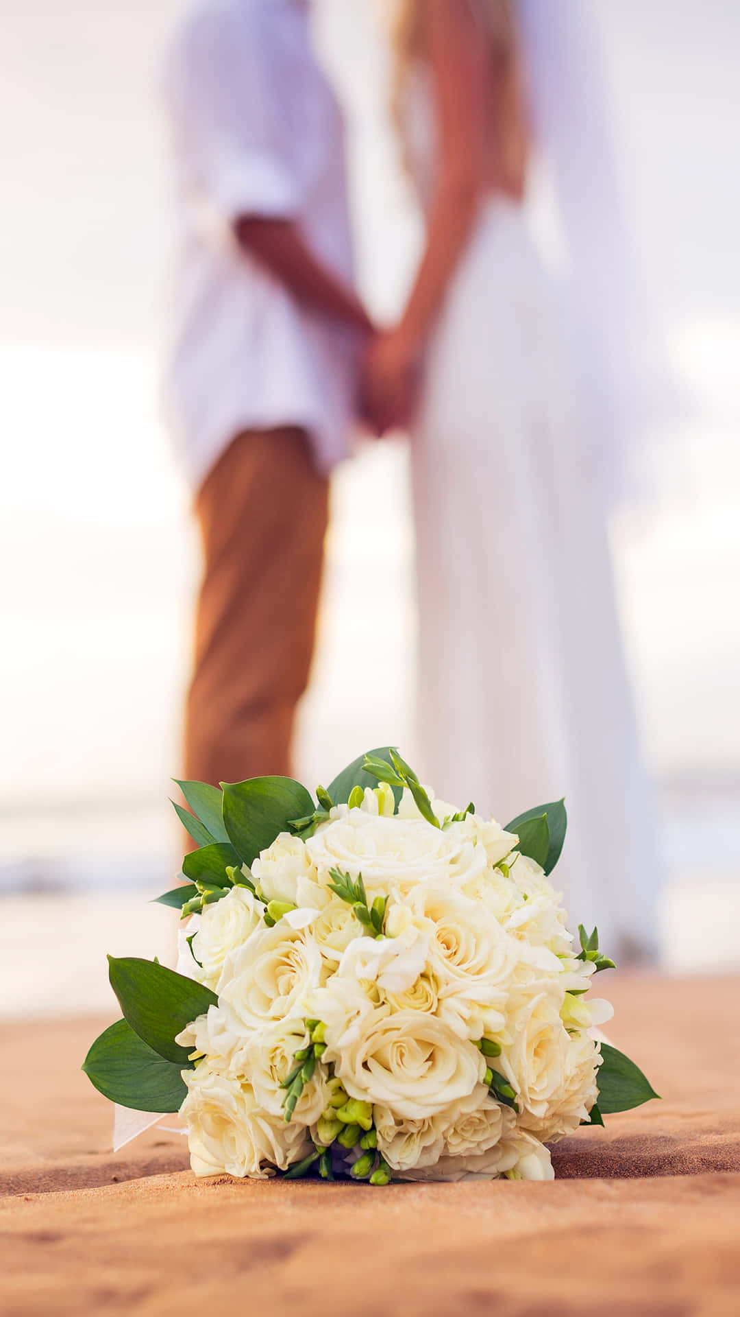 Wedding Couple Roses On Sand